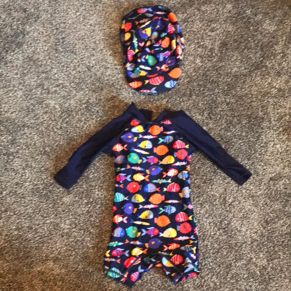 One piece rash guard swimsuit with hat